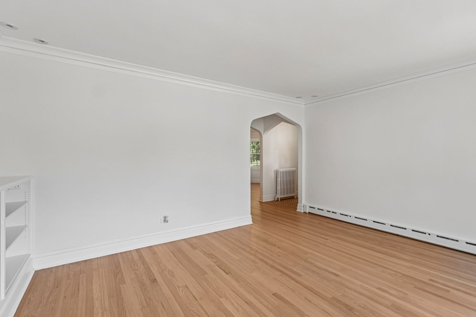 5253 Cleveland Street Skokie, IL 60077 - Photo 8 of 57 an empty room with wooden floor and windows
