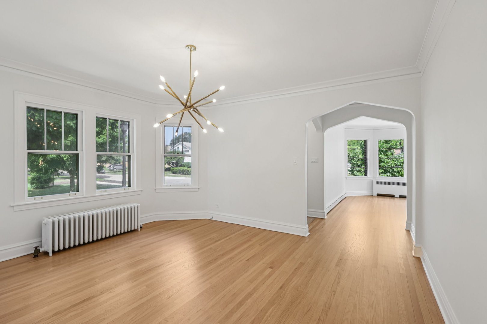 5253 Cleveland Street Skokie, IL 60077 - Photo 10 of 57 wooden floor in an empty room with a window