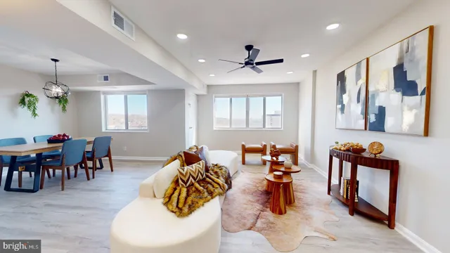 a view of a dining room with furniture and wooden floor
