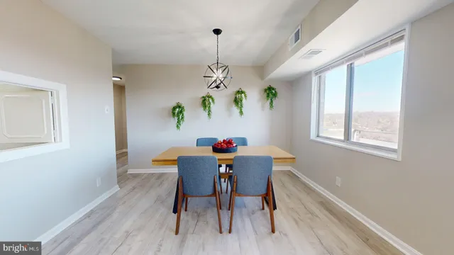 a view of a swimming pool with an outdoor seating