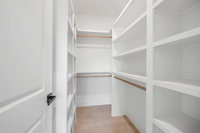 a bathroom with a sink toilet a mirror and shower