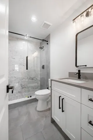 a big house with a big yard and large trees