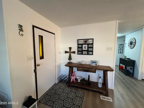 a room with furniture and wooden floor