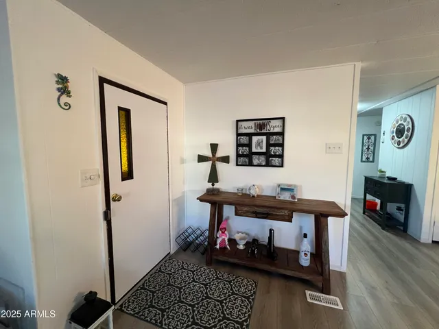 a room with furniture and wooden floor