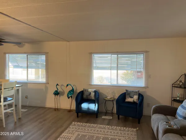 a living room with furniture and windows