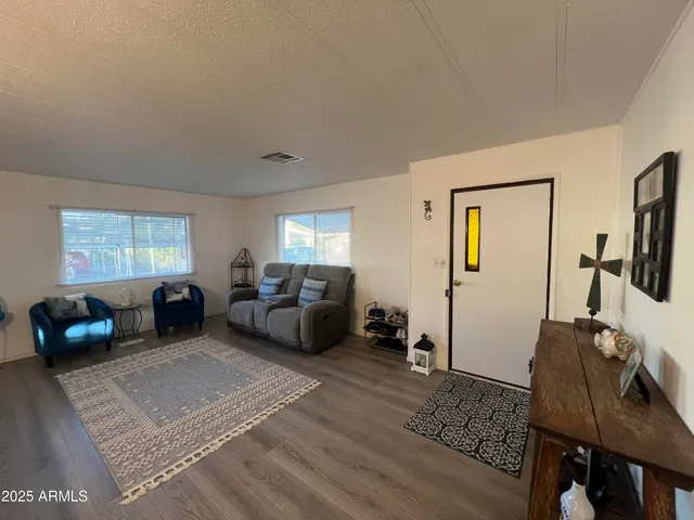 a bedroom with furniture and a window