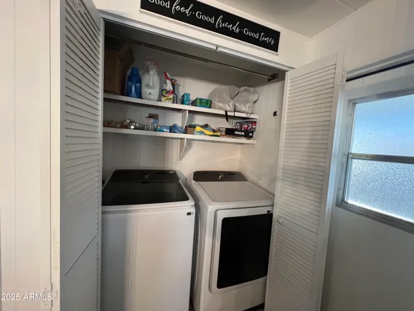 a utility room with dryer and washer