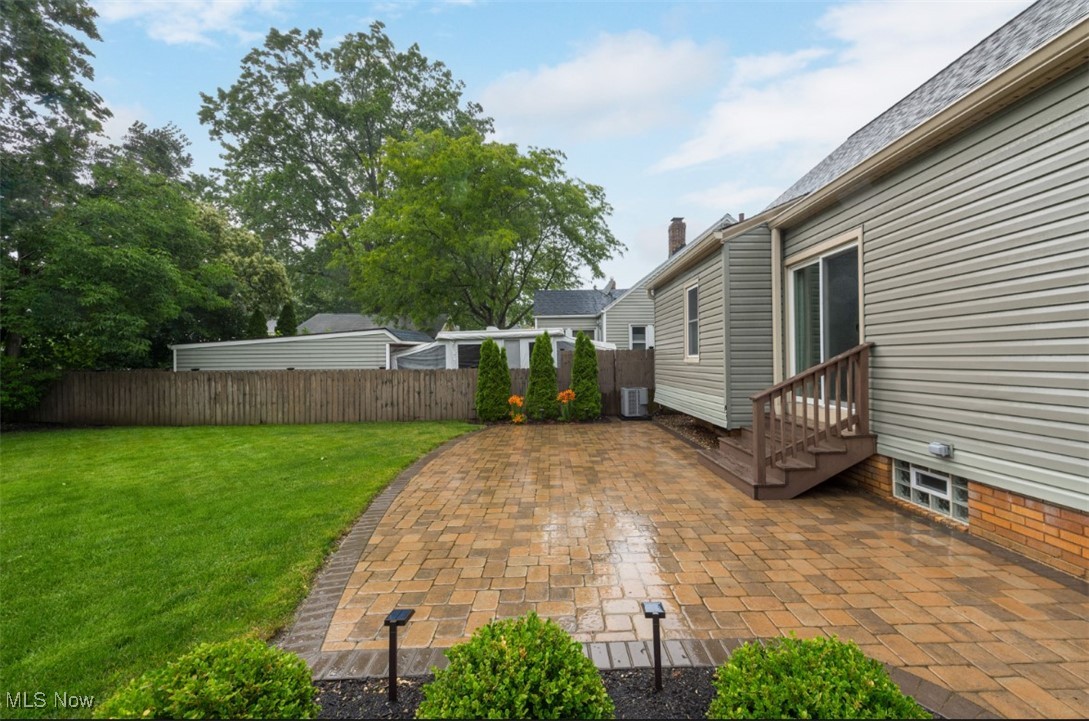 16501 Munn Road Cleveland, OH 44111 - Photo 38 of 42 View of yard featuring entry steps and a patio area