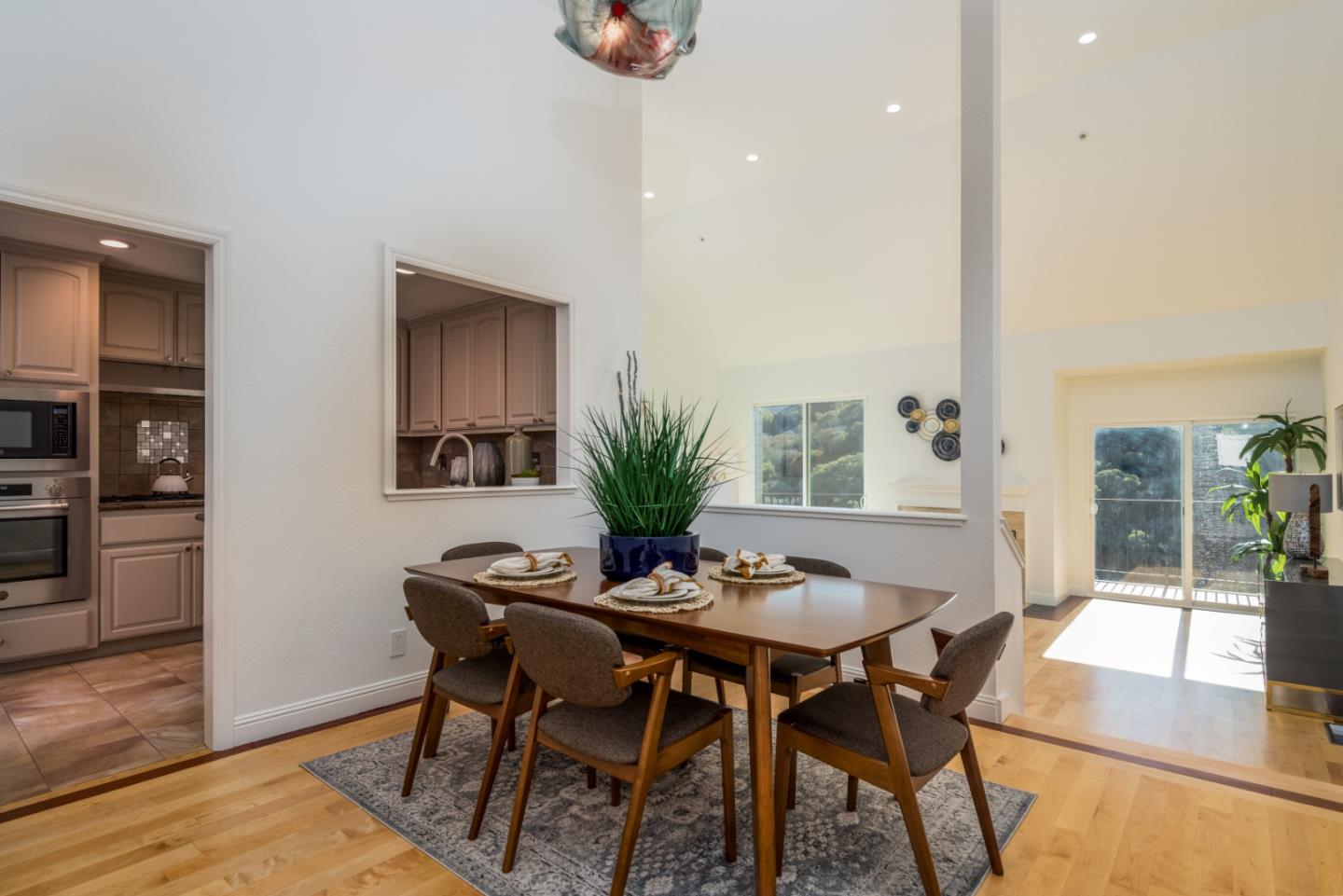 1040 Continentals Way, Unit 12 Belmont, CA 94002 - Photo 12 of 30 a dining room with furniture and window
