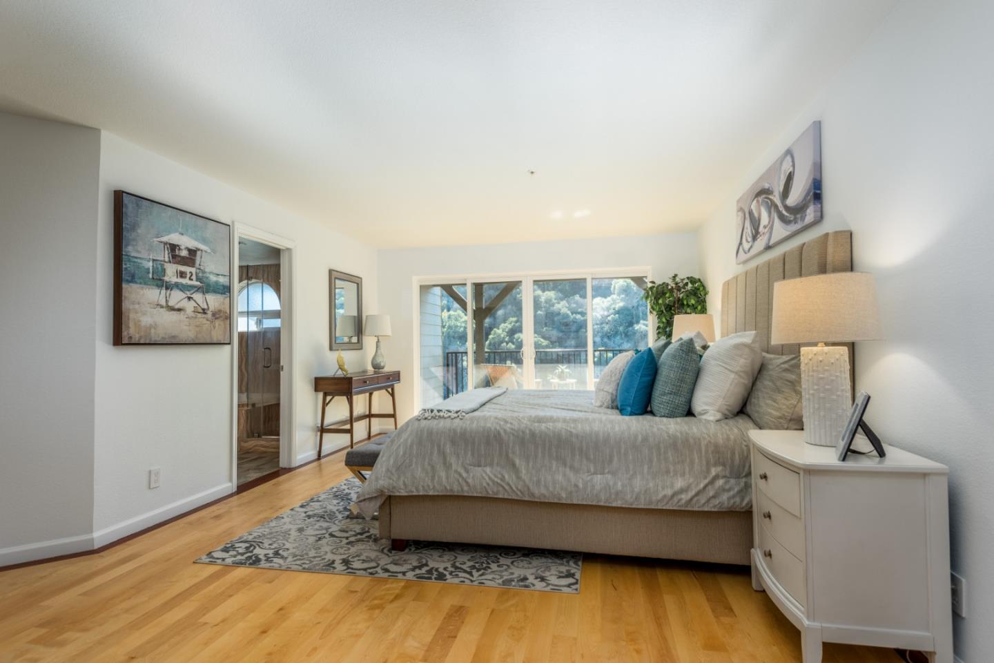 1040 Continentals Way, Unit 12 Belmont, CA 94002 - Photo 13 of 30 a bedroom with a bed and wooden floor