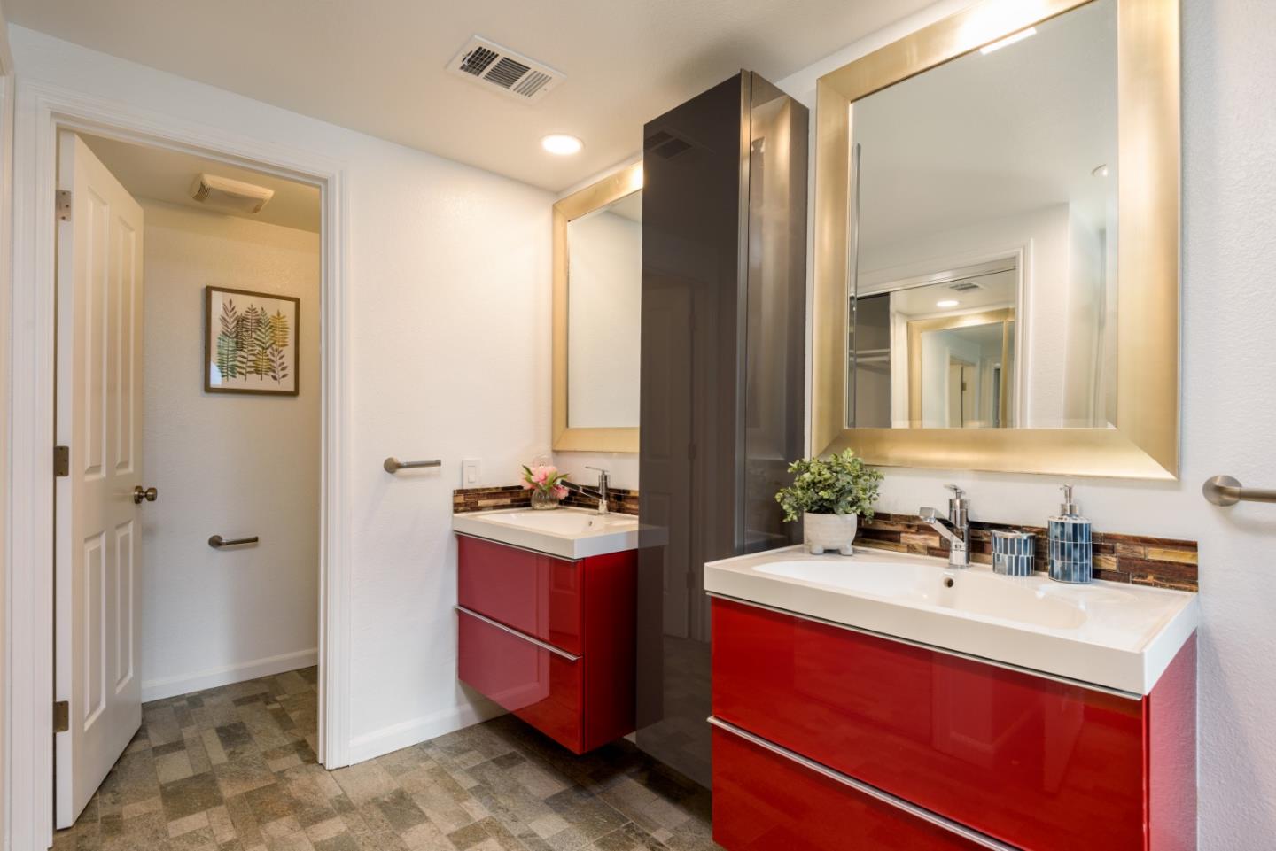 1040 Continentals Way, Unit 12 Belmont, CA 94002 - Photo 15 of 30 a bathroom with a double vanity sink mirror and double