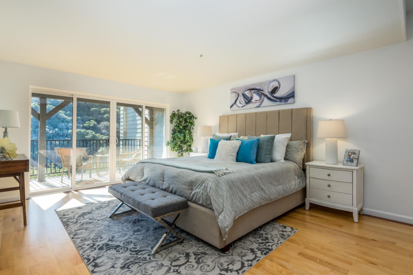 1040 Continentals Way, Unit 12 Belmont, CA 94002 - Photo 16 of 30 a bedroom with a bed and a large window
