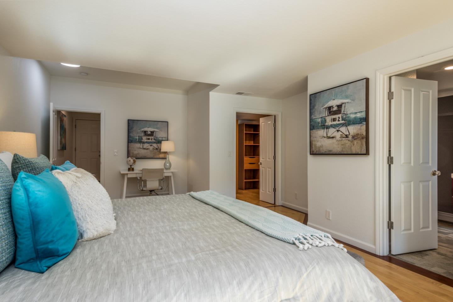 1040 Continentals Way, Unit 12 Belmont, CA 94002 - Photo 19 of 30 a spacious bedroom with a bed and a cabinets