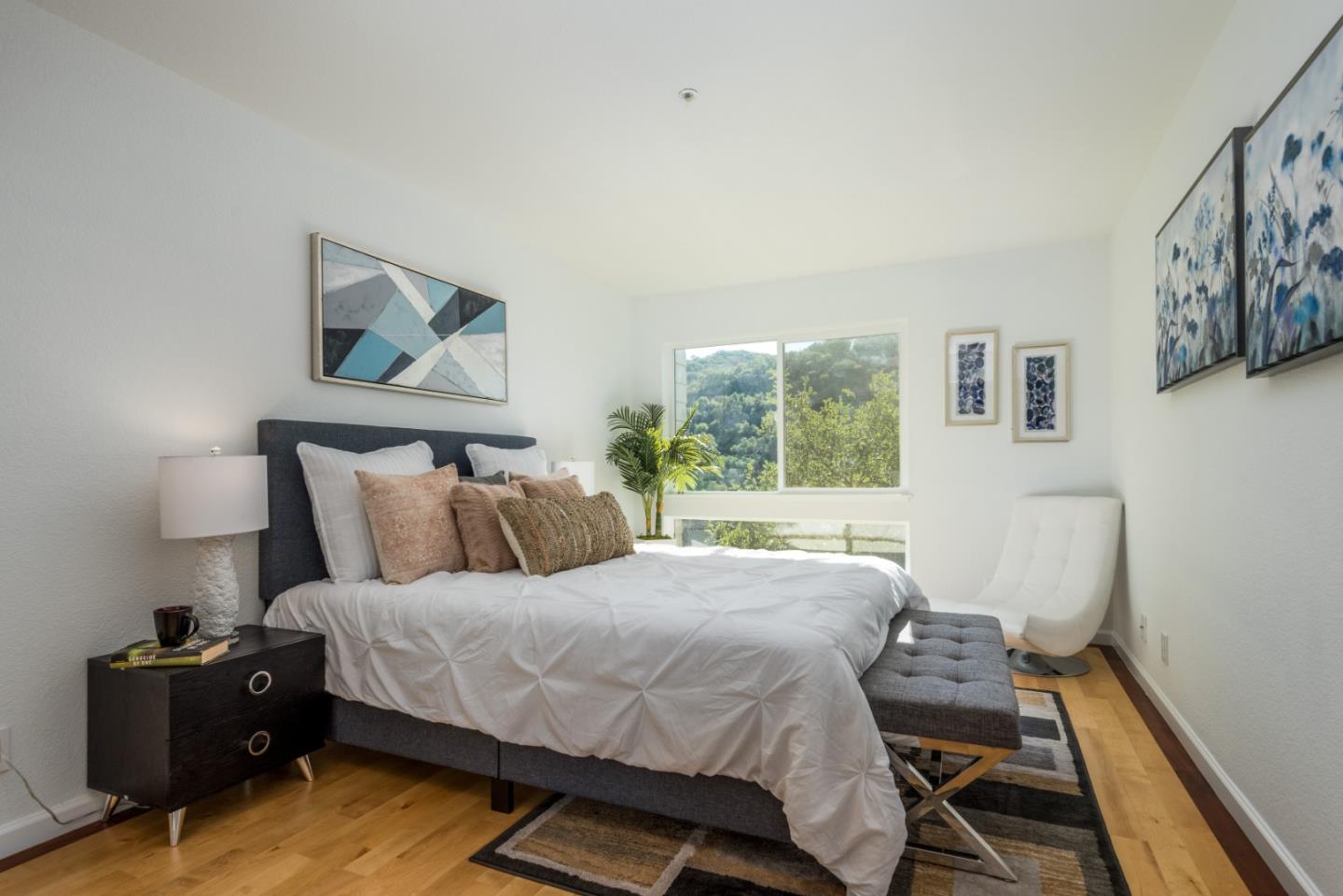 1040 Continentals Way, Unit 12 Belmont, CA 94002 - Photo 20 of 30 a bedroom with a bed and window