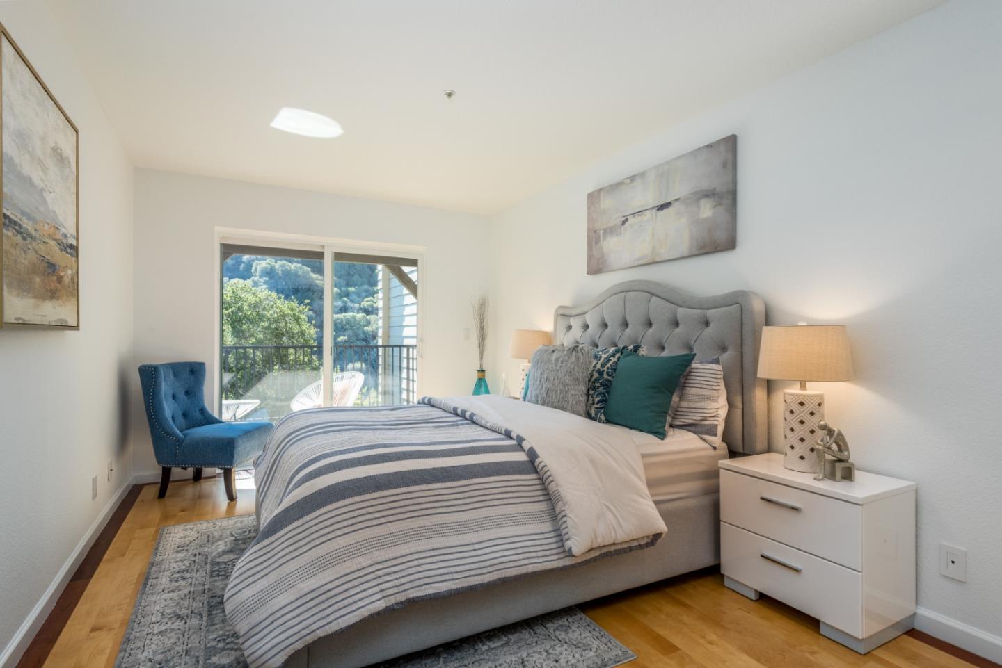 1040 Continentals Way, Unit 12 Belmont, CA 94002 - Photo 24 of 30 a bedroom with a bed and a chair
