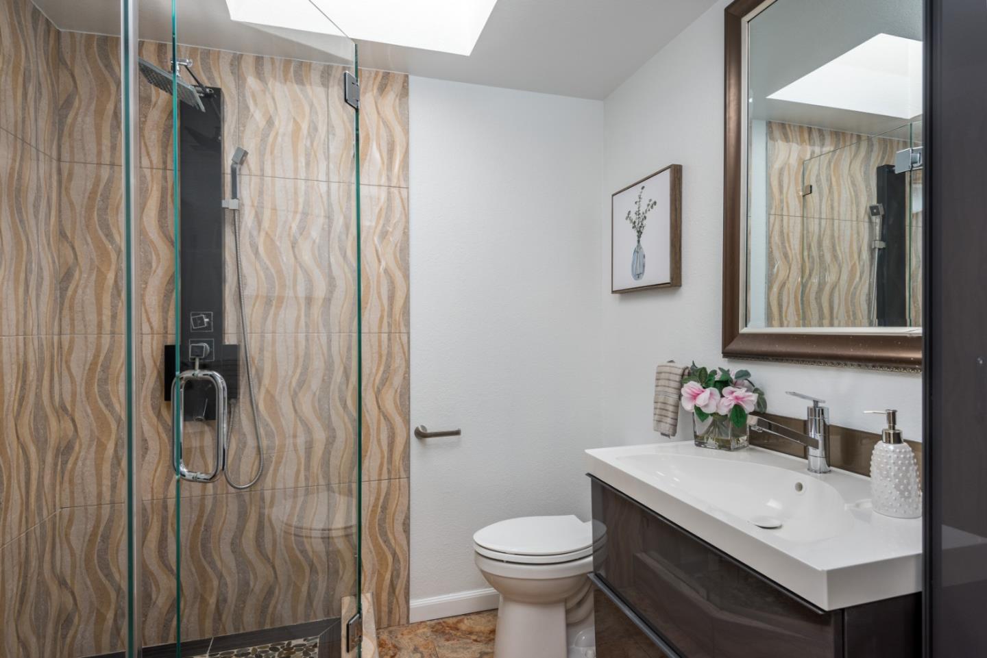 1040 Continentals Way, Unit 12 Belmont, CA 94002 - Photo 25 of 30 a bathroom with a sink toilet and shower