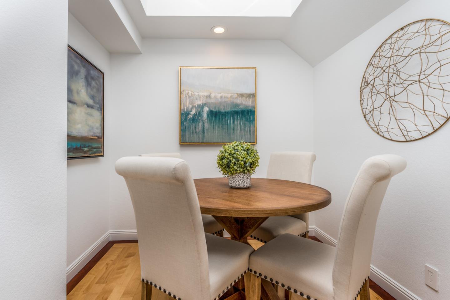 1040 Continentals Way, Unit 12 Belmont, CA 94002 - Photo 8 of 30 a view of a dining room with furniture and wooden floor