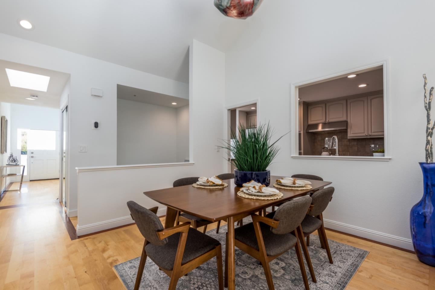 1040 Continentals Way, Unit 12 Belmont, CA 94002 - Photo 10 of 30 a dining room with furniture and wooden floor