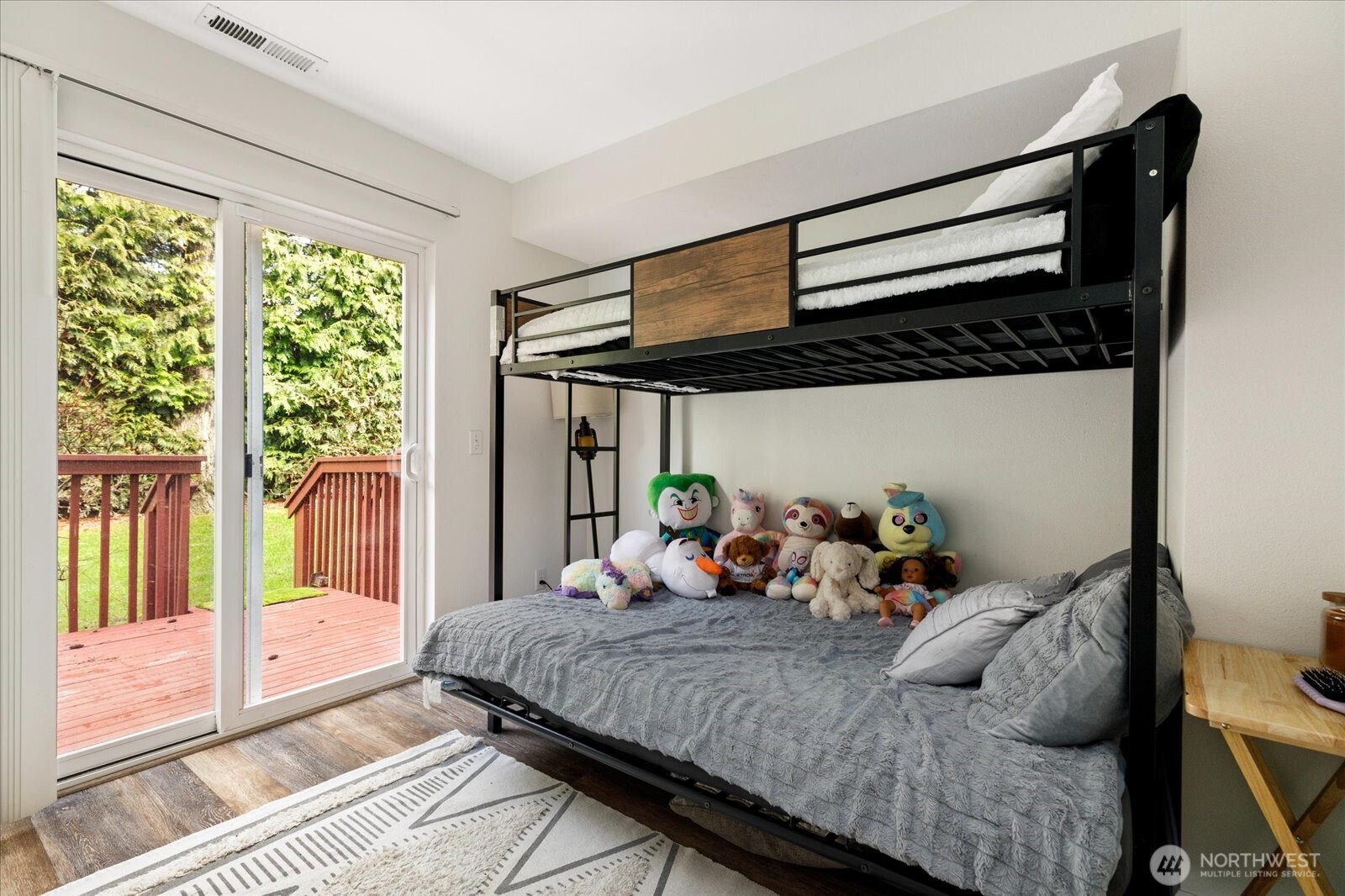 30875 State Rte 20, Unit M2 Oak Harbor, WA 98277 - Photo 12 of 29 a bedroom with a bed a large window with outer view and balcony