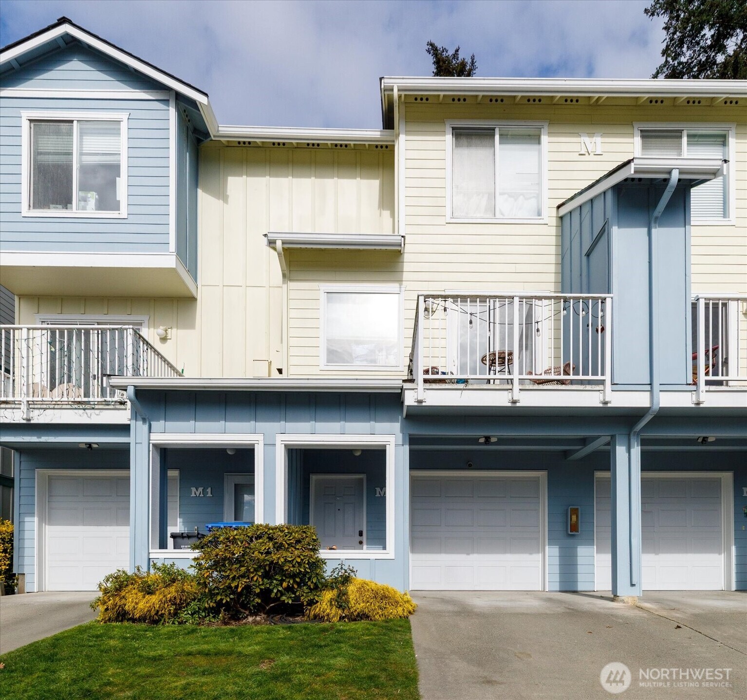 30875 State Rte 20, Unit M2 Oak Harbor, WA 98277 - Photo 2 of 29 a house view with a garden space