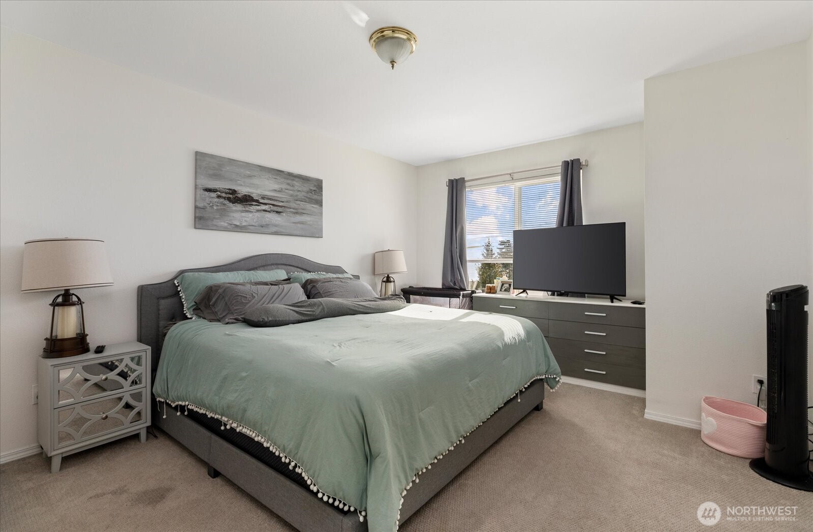 30875 State Rte 20, Unit M2 Oak Harbor, WA 98277 - Photo 21 of 29 a bedroom with a bed and a flat tv screen on the dresser