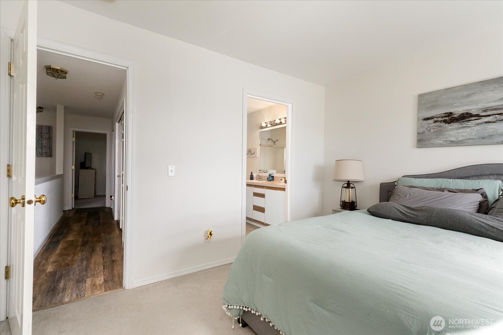 30875 State Rte 20, Unit M2 Oak Harbor, WA 98277 - Photo 22 of 29 a bedroom with a bed and a view of bathroom