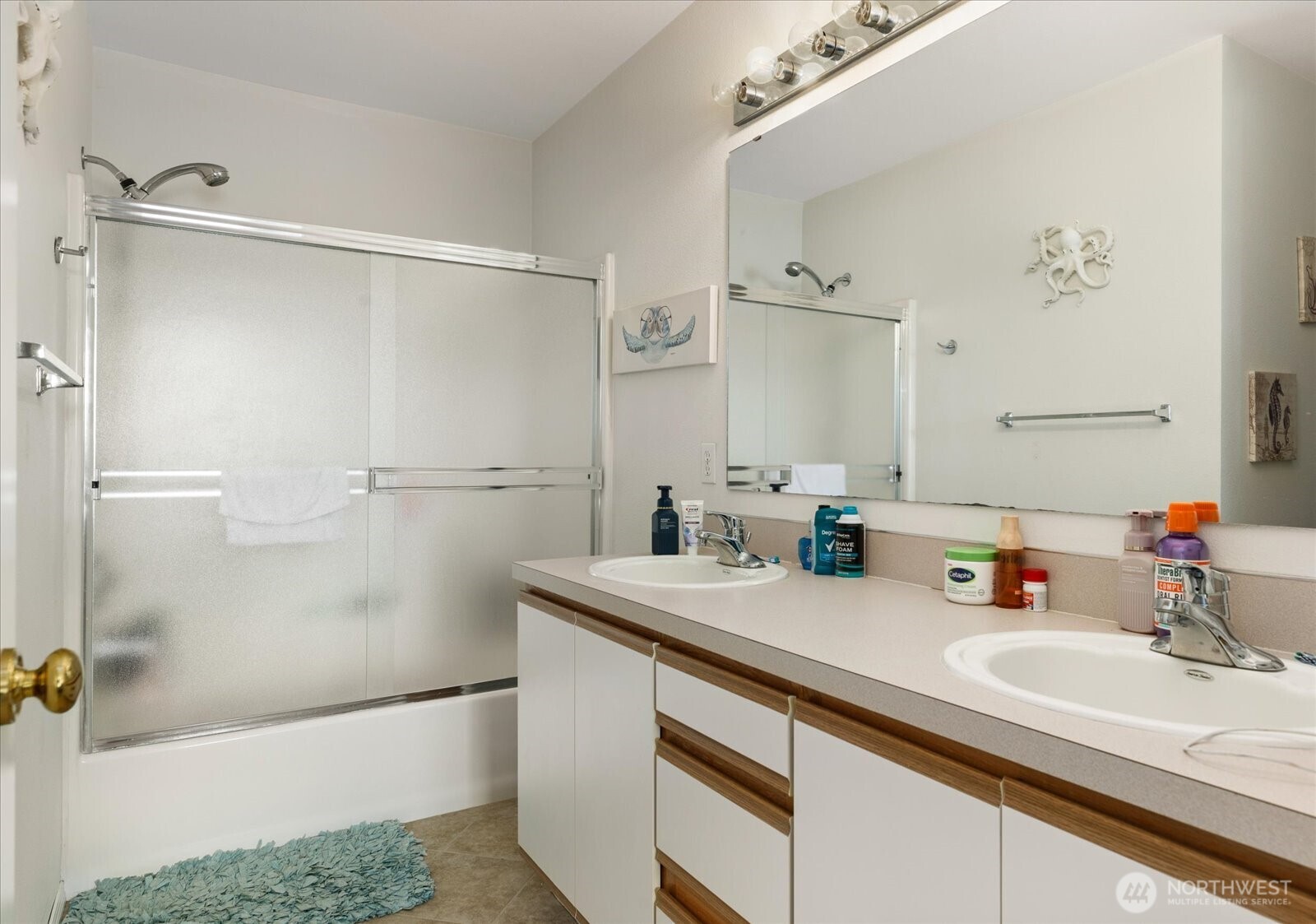 30875 State Rte 20, Unit M2 Oak Harbor, WA 98277 - Photo 23 of 29 a bathroom with a sink and a mirror