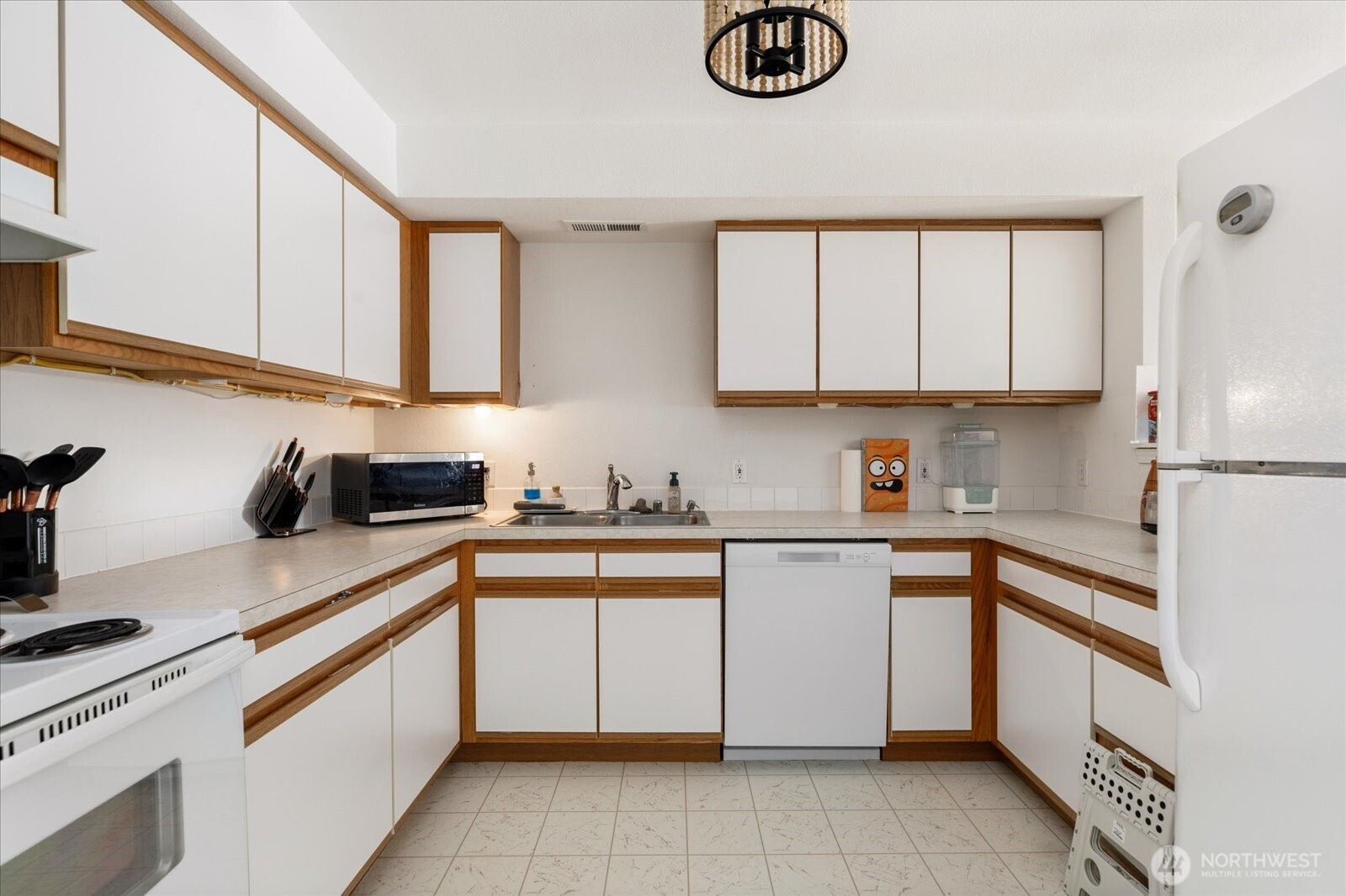 30875 State Rte 20, Unit M2 Oak Harbor, WA 98277 - Photo 10 of 29 a kitchen with cabinets appliances a sink and a counter space