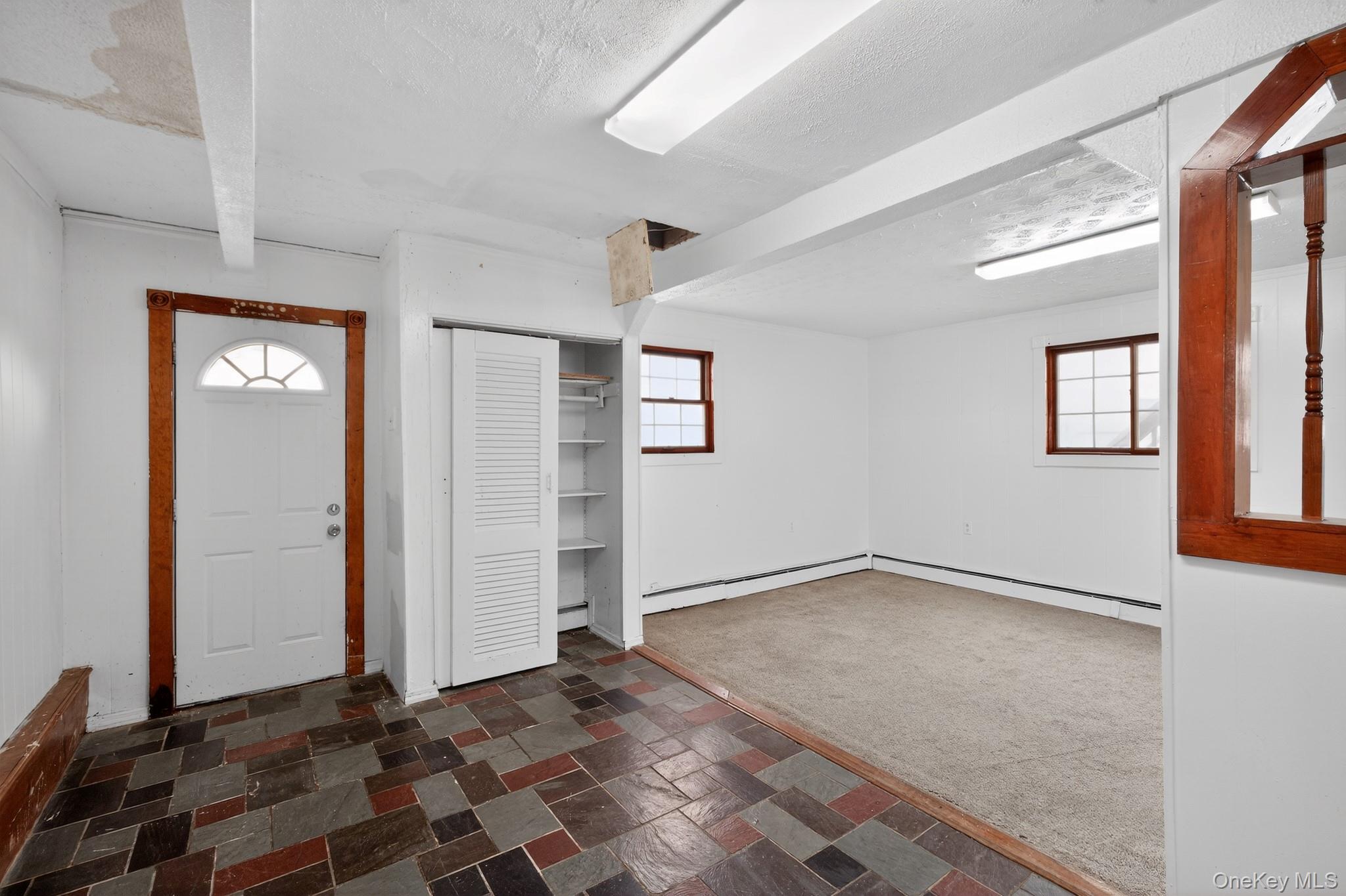 138 Spring Street Massapequa, NY 11758 - Photo 33 of 45 an empty room with windows