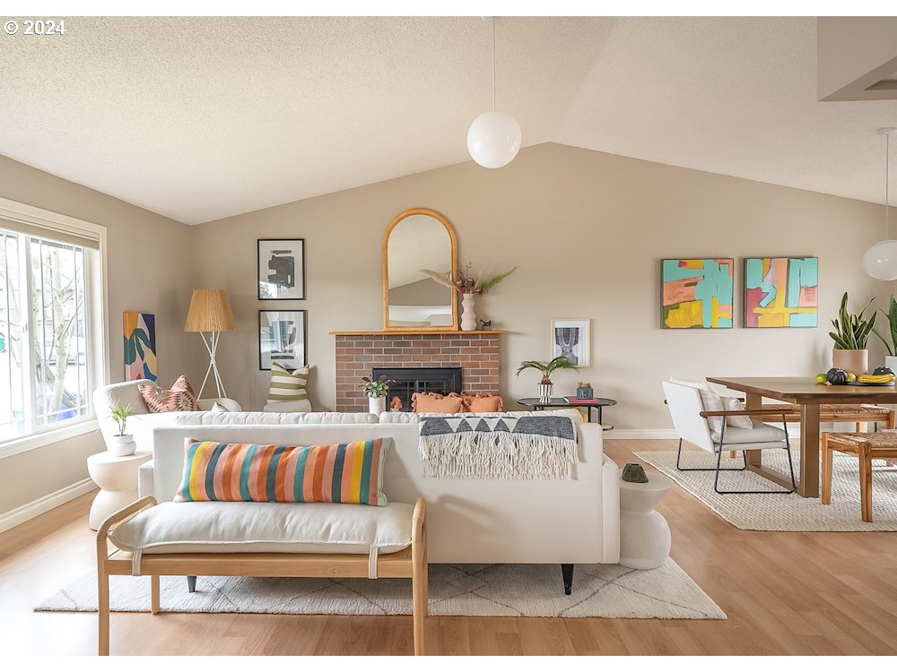 2097 Southwest Brixton Place Gresham, OR 97080 - Photo 11 of 43 a living room with furniture and a fireplace