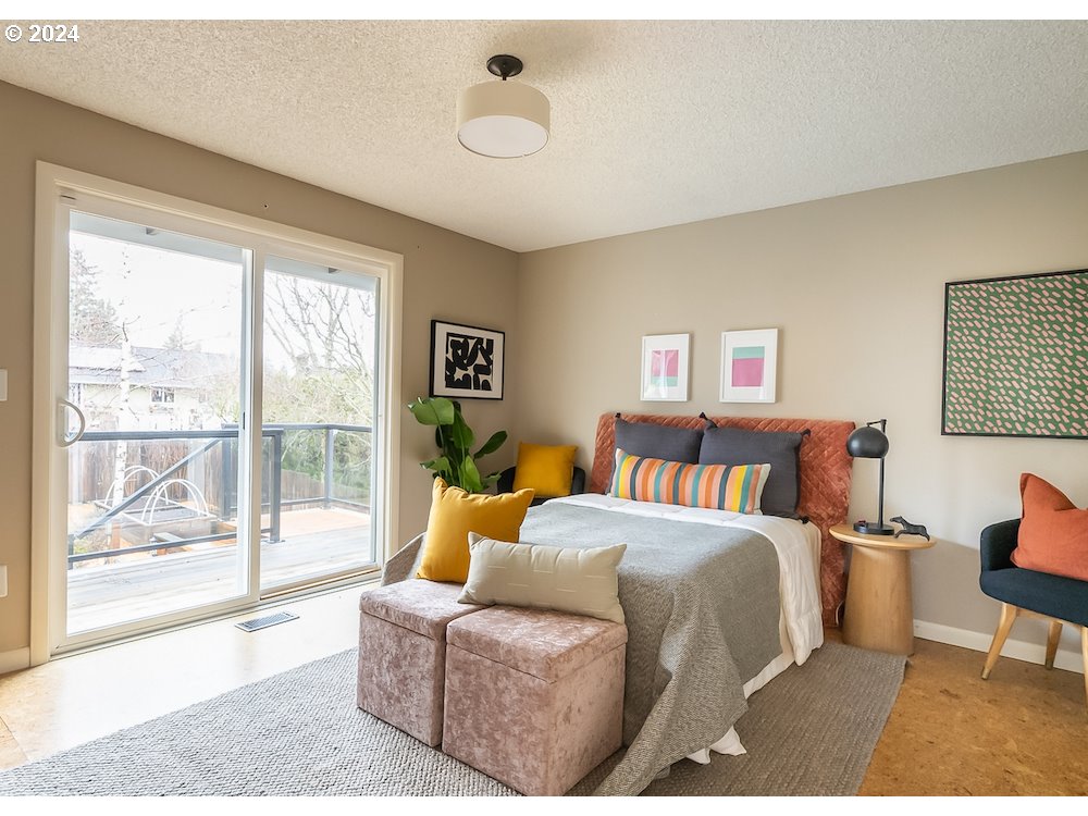 2097 Southwest Brixton Place Gresham, OR 97080 - Photo 23 of 43 a bedroom with a bed and a large window