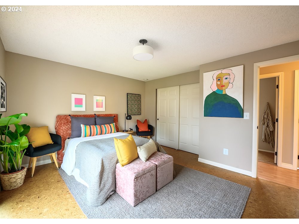 2097 Southwest Brixton Place Gresham, OR 97080 - Photo 24 of 43 a spacious bedroom with a bed and a couch