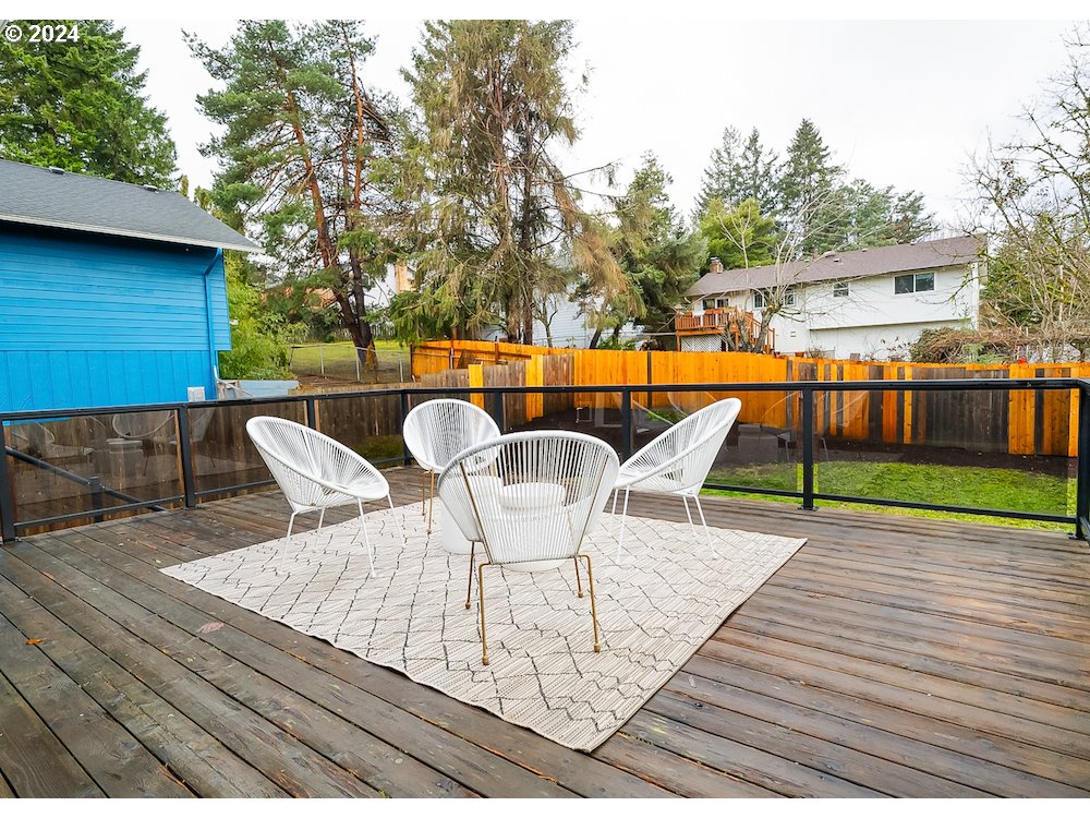 2097 Southwest Brixton Place Gresham, OR 97080 - Photo 37 of 43 a patio with wooden floor table and chairs