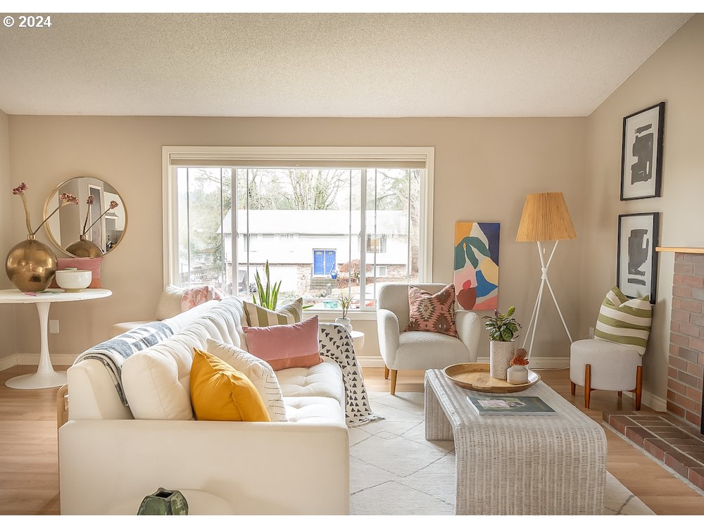 2097 Southwest Brixton Place Gresham, OR 97080 - Photo 7 of 43 a living room with furniture and a large window