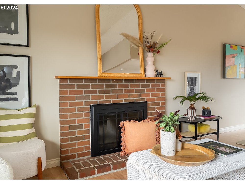 2097 Southwest Brixton Place Gresham, OR 97080 - Photo 9 of 43 a living room with furniture a fireplace and a potted plant