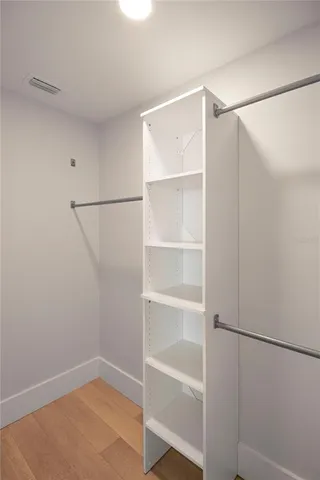a view of an empty walk in closet