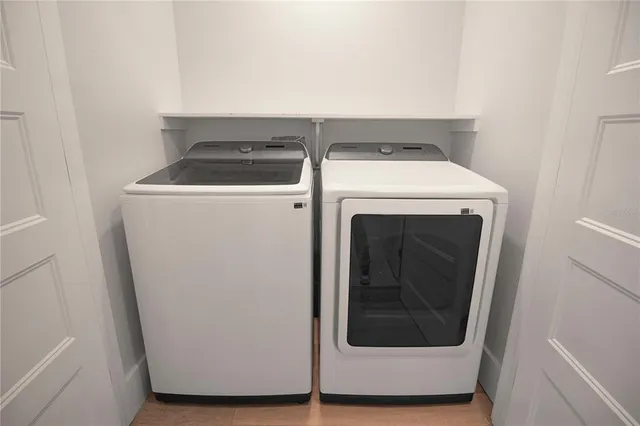 a utility room with dryer and washer