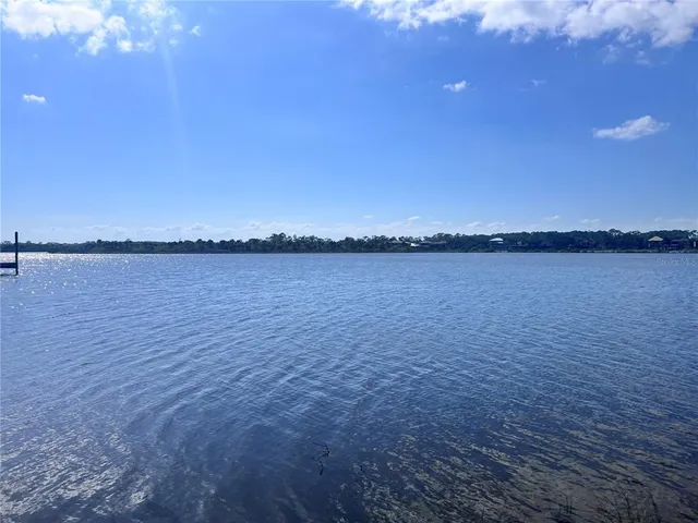 a view of an ocean beach and mountain view