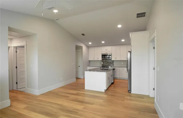 a view of kitchen with wooden floor