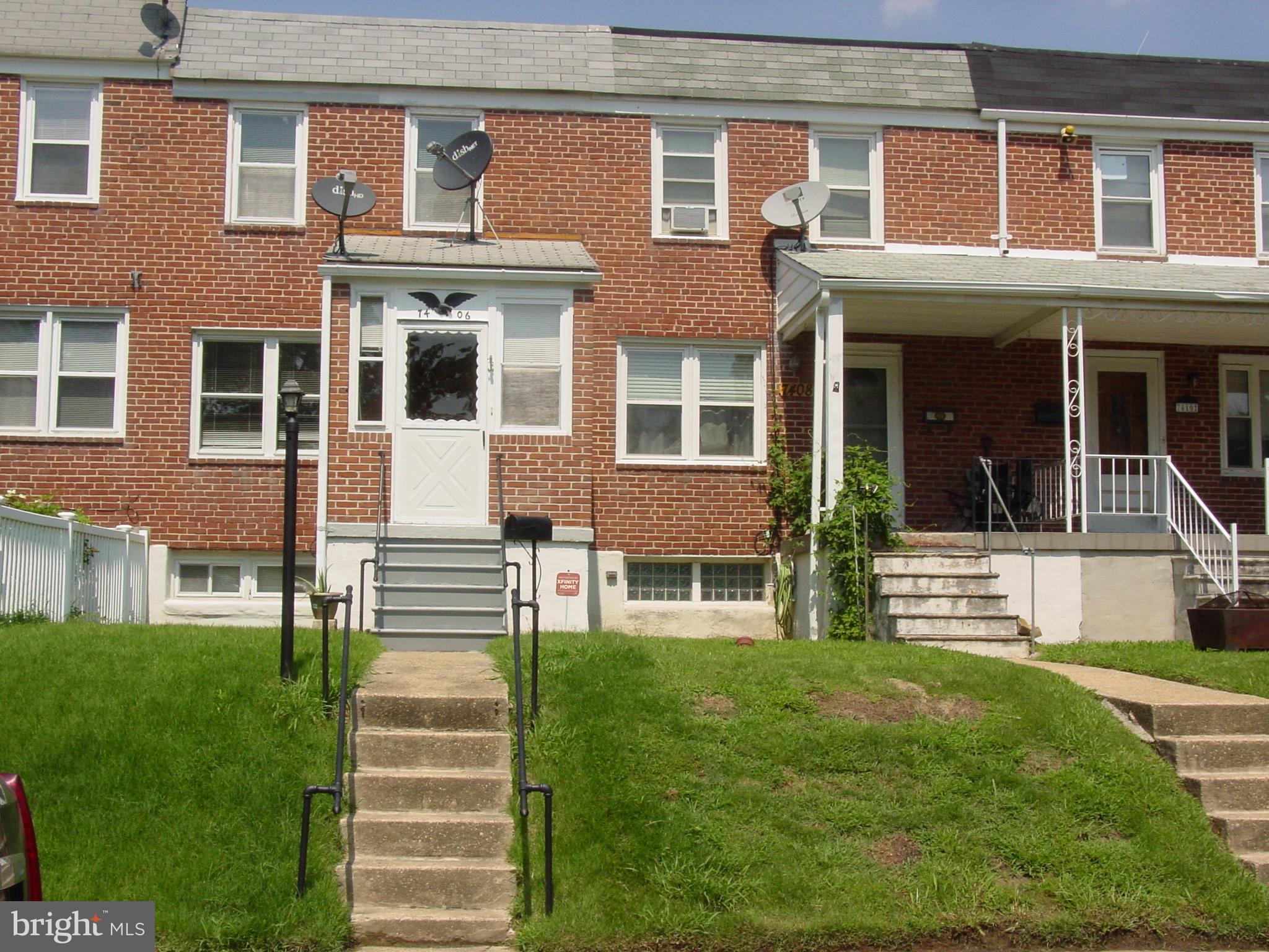 7406 Kirtley Road Baltimore, MD 21222 - Photo 1 of 21 front view of a brick building with a yard