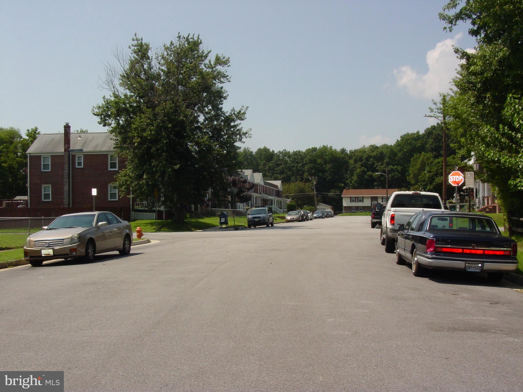 7406 Kirtley Road Baltimore, MD 21222 - Photo 2 of 21 a view of street with parked cars