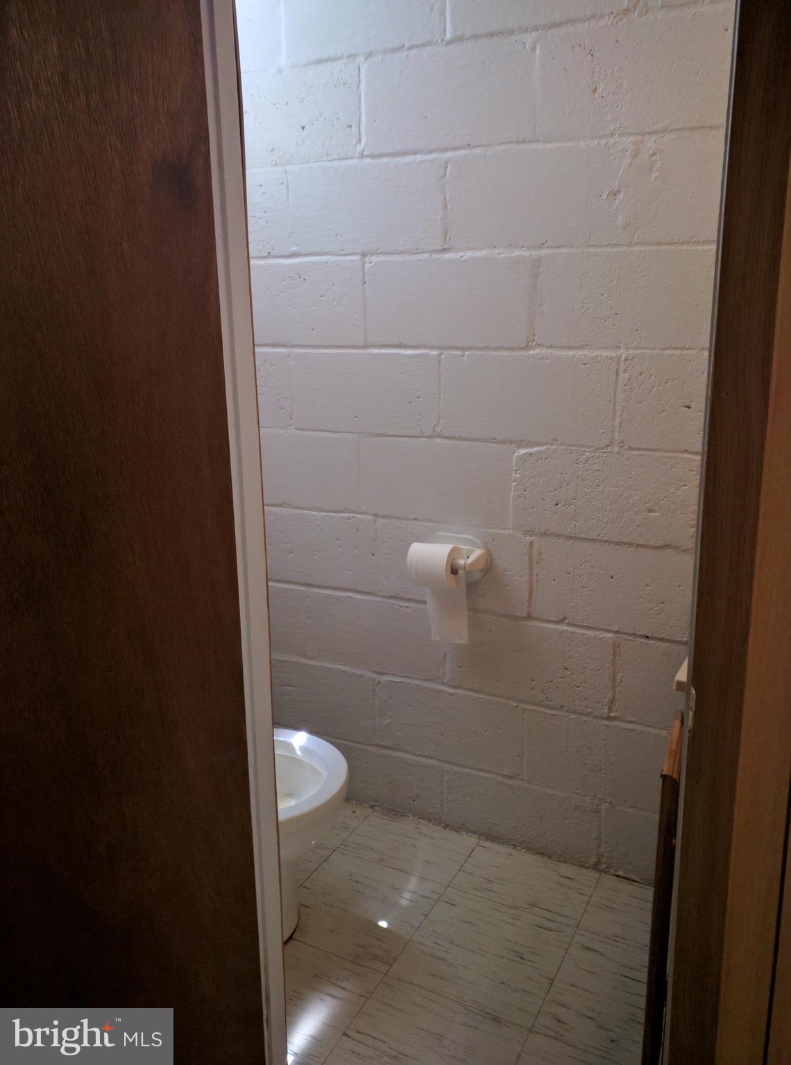 7406 Kirtley Road Baltimore, MD 21222 - Photo 13 of 21 a bathroom with a toilet