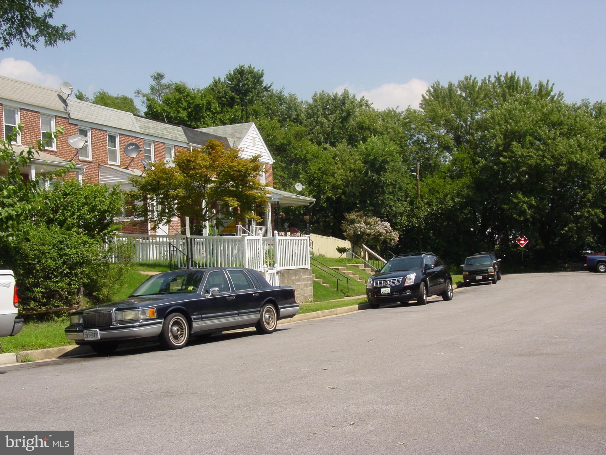 7406 Kirtley Road Baltimore, MD 21222 - Photo 14 of 21 a view of car parked in front of house