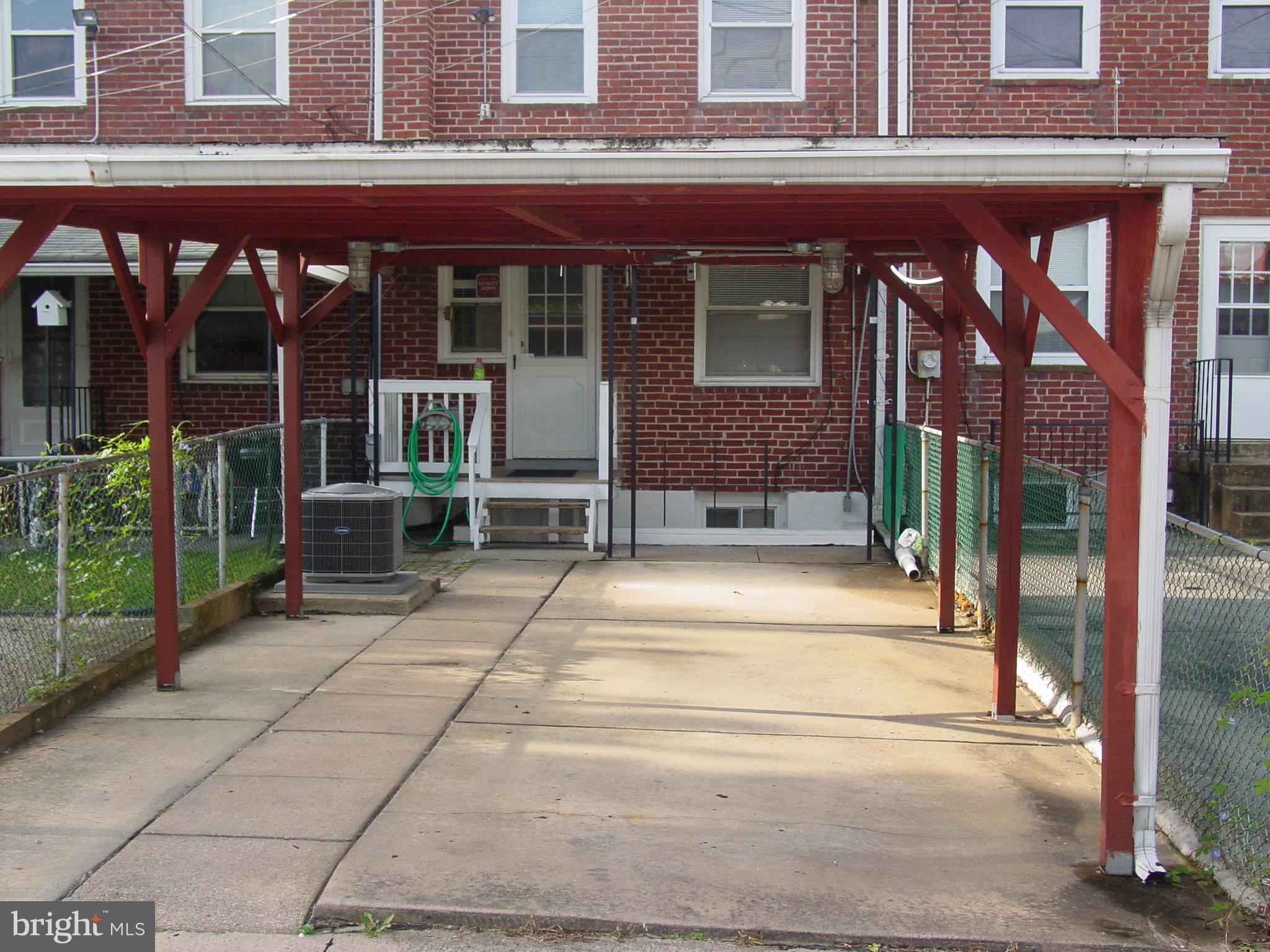 7406 Kirtley Road Baltimore, MD 21222 - Photo 16 of 21 a view of brick building with a outdoor space