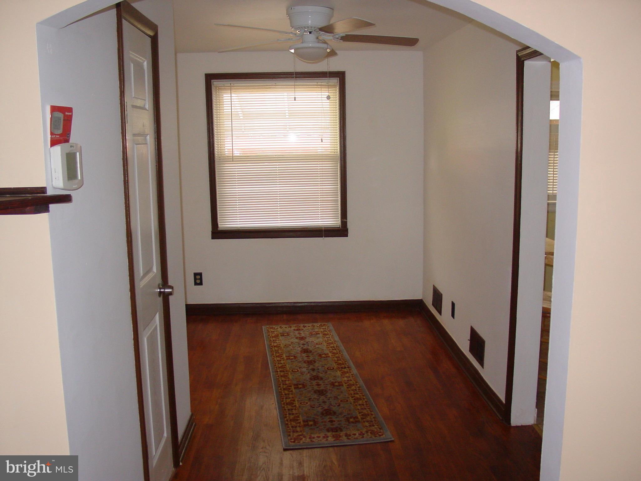 7406 Kirtley Road Baltimore, MD 21222 - Photo 18 of 21 a view of an empty room with a window