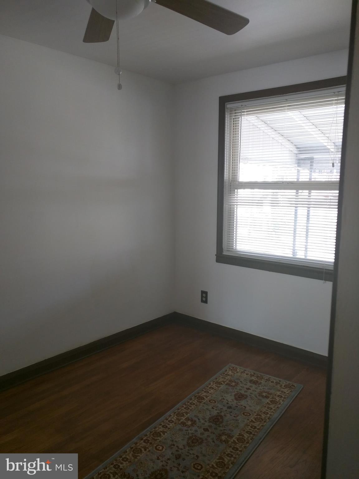 7406 Kirtley Road Baltimore, MD 21222 - Photo 6 of 21 an empty room with a window