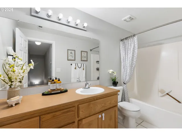a bathroom with a sink double vanity and a mirror