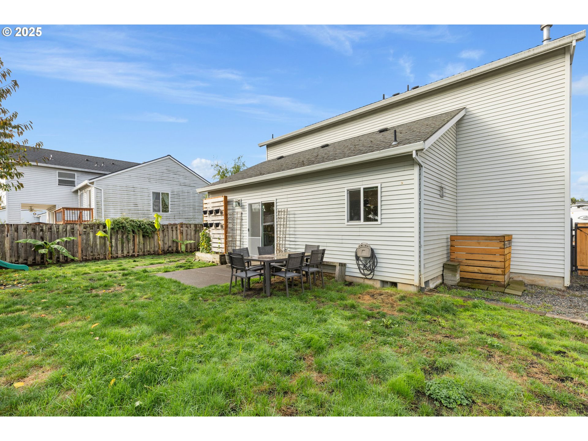 51692 Southeast 3rd Street Scappoose, OR 97056 - Photo 20 of 22 a backyard of a house with table and chairs