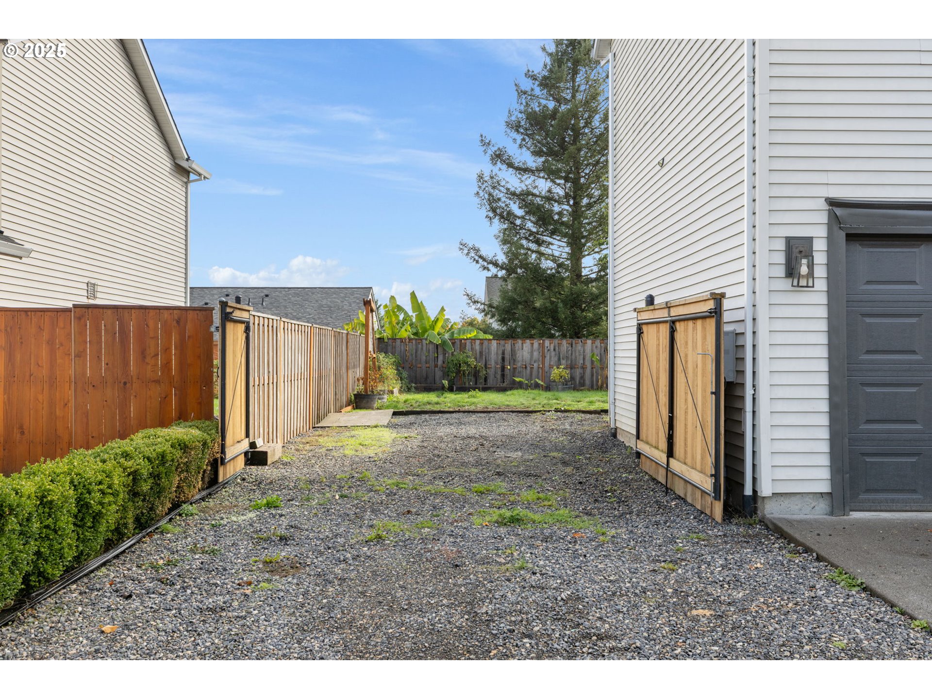51692 Southeast 3rd Street Scappoose, OR 97056 - Photo 22 of 22 a view of a backyard with pathway