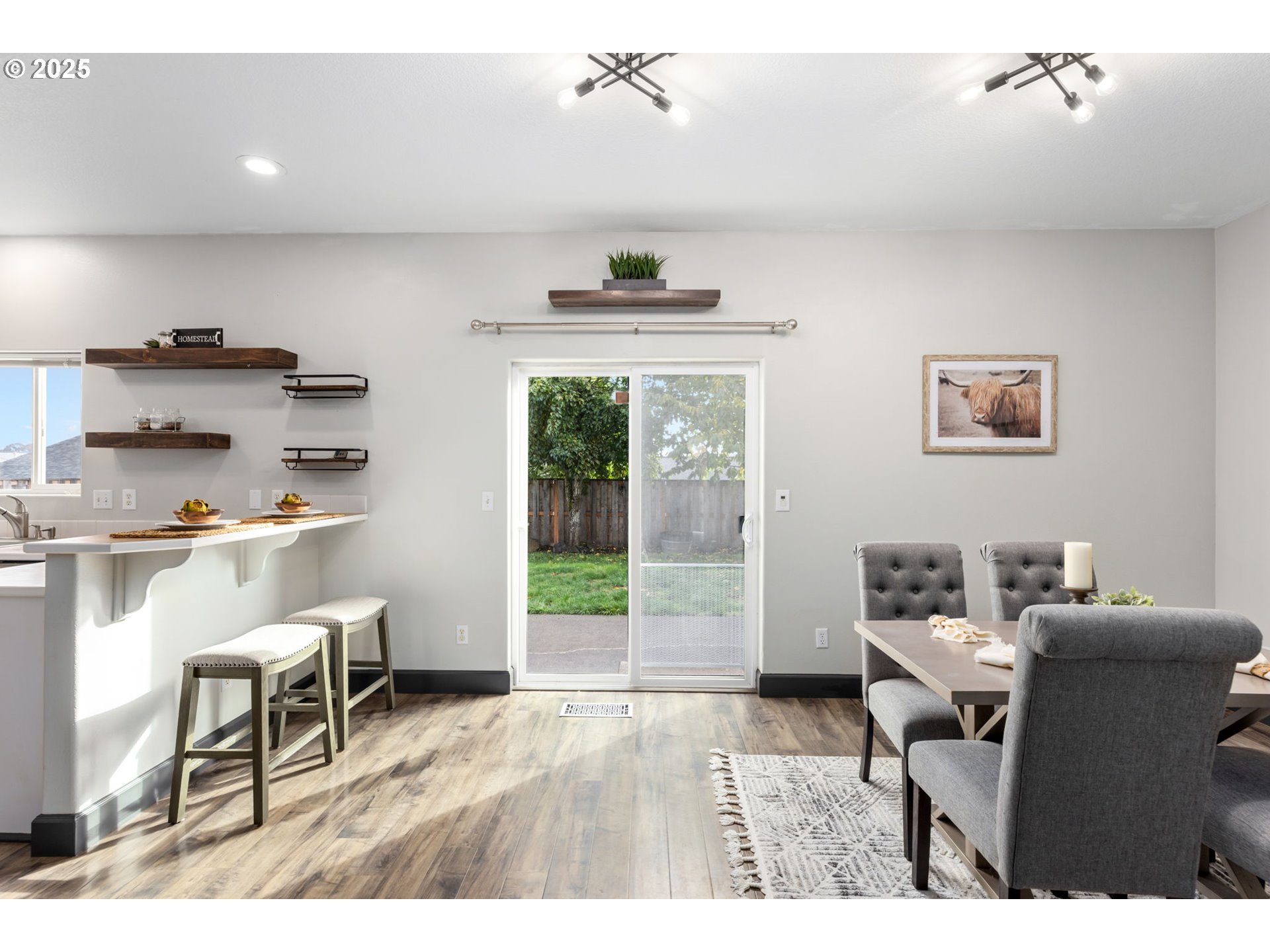 51692 Southeast 3rd Street Scappoose, OR 97056 - Photo 5 of 22 a living room with furniture a window and a dining table